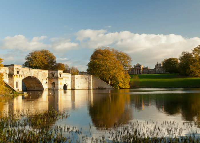 The Grand Bridge in the grounds of Blenheim Palace, Woodstock. The palace in the background.