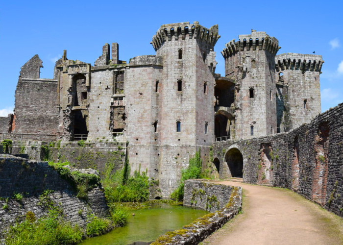 Raglan Castle viewed from the moat on a sunny day.