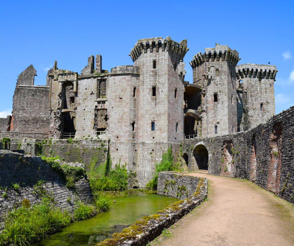 Raglan Castle viewed from the moat on a sunny day.