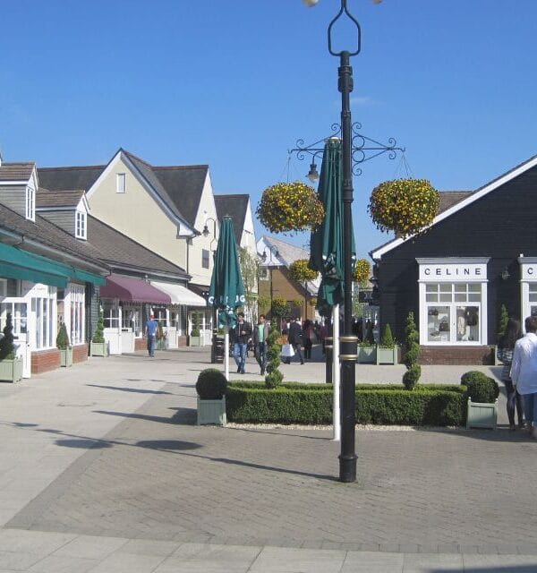 Bicester Village in the sun, showing the awnings over luxury brand shops